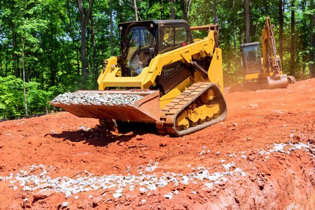 Excavation at a Construction Site, Mini Loader Bobcat Transports Crushed Stone to Different Construction